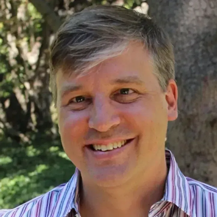 mark heynen from knapsack, white man, smiling granny hair